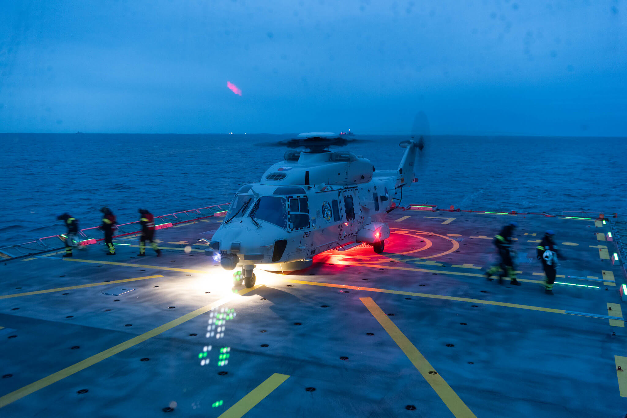 Boxhoorn - A Dutch Navy NH-90 helicopter lands on SNMG1 HDMS Esbern Snare in order to perform a Rotors Running Refuelling (RRR) during Trident Juncture Exercise in 2018. NATO