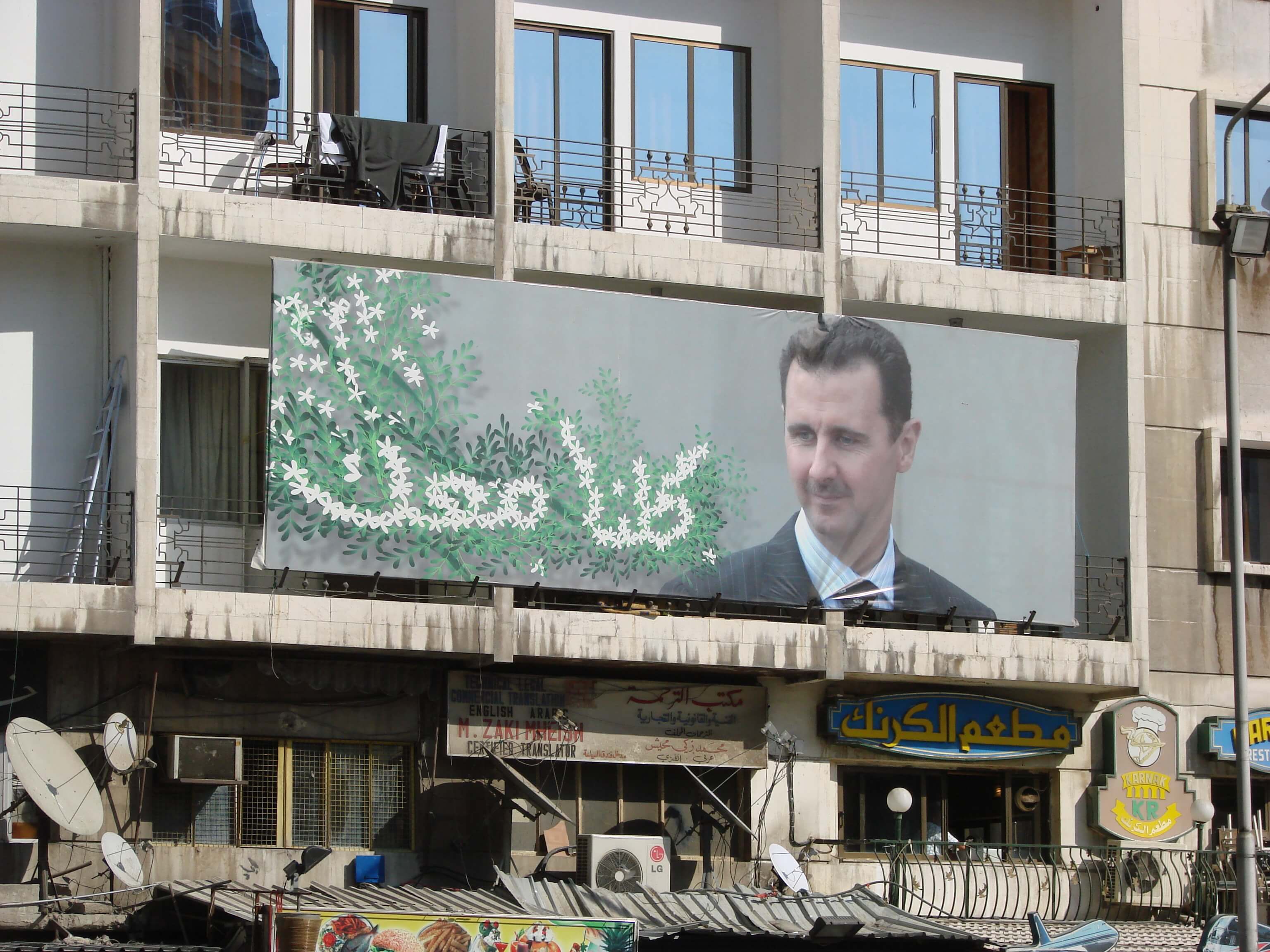 Propaganda poster met Bashar al-Assad  © Michael Goodine / Flickr
