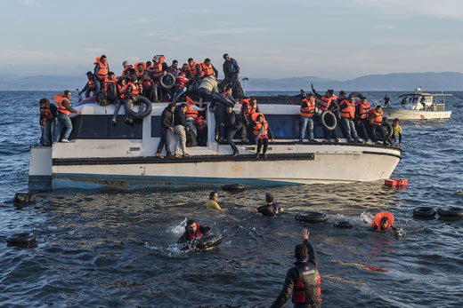 Syrian and Iraqi refugees arrive from Turkey to Lesbos Greece in 2015