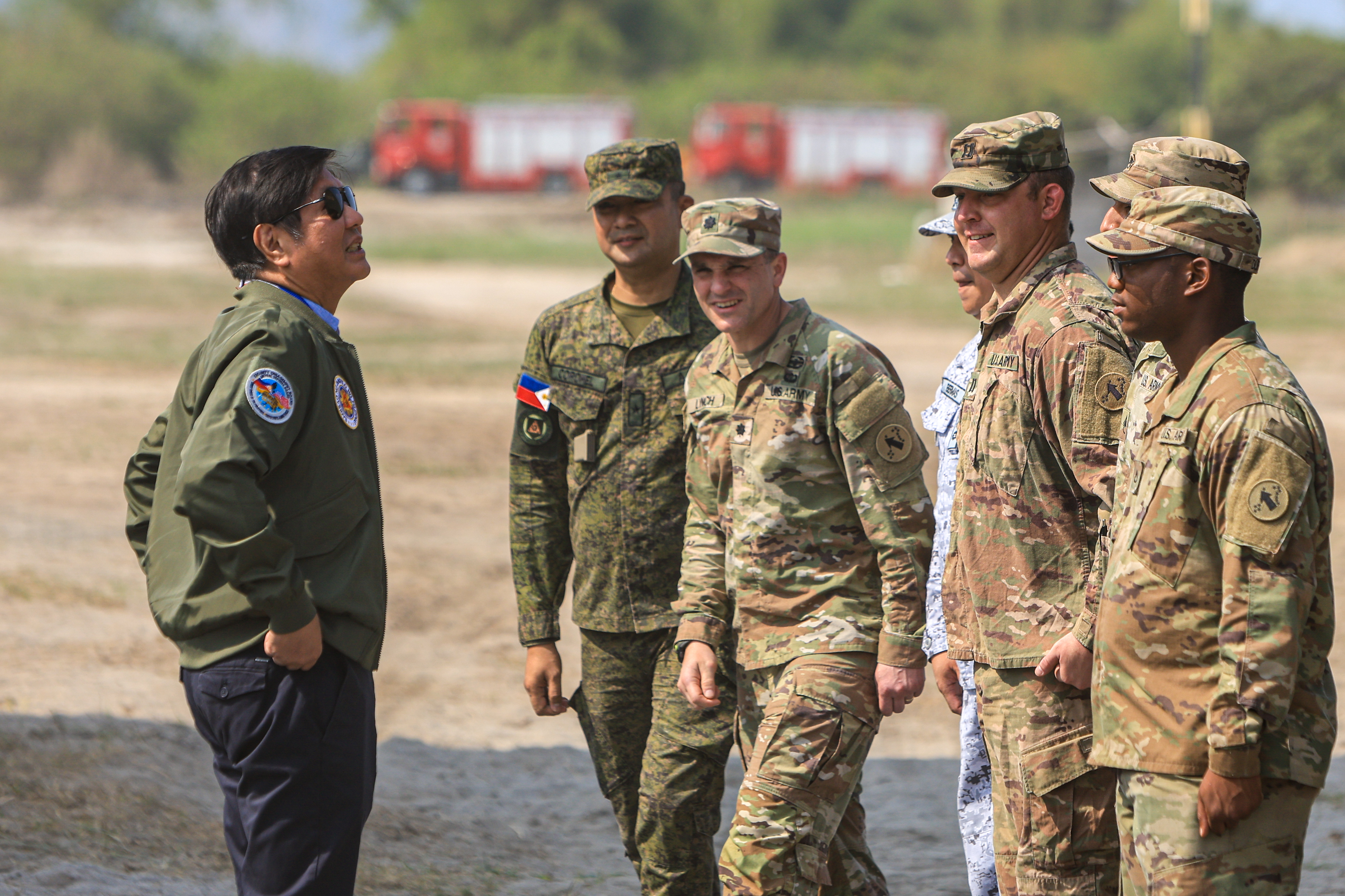 Filipino President Ferdinand Marcos Jr. meets with Filipino and American soldiers at a naval base, as he watches the Combined Joint Littoral Live Fire Exercise as part of the US-Philippines Balikatan Exercises in San Miguel, Zambales, The Philippines, on 28 April 2023. © Ceng Shou Yi, NurPhoto via Reuters