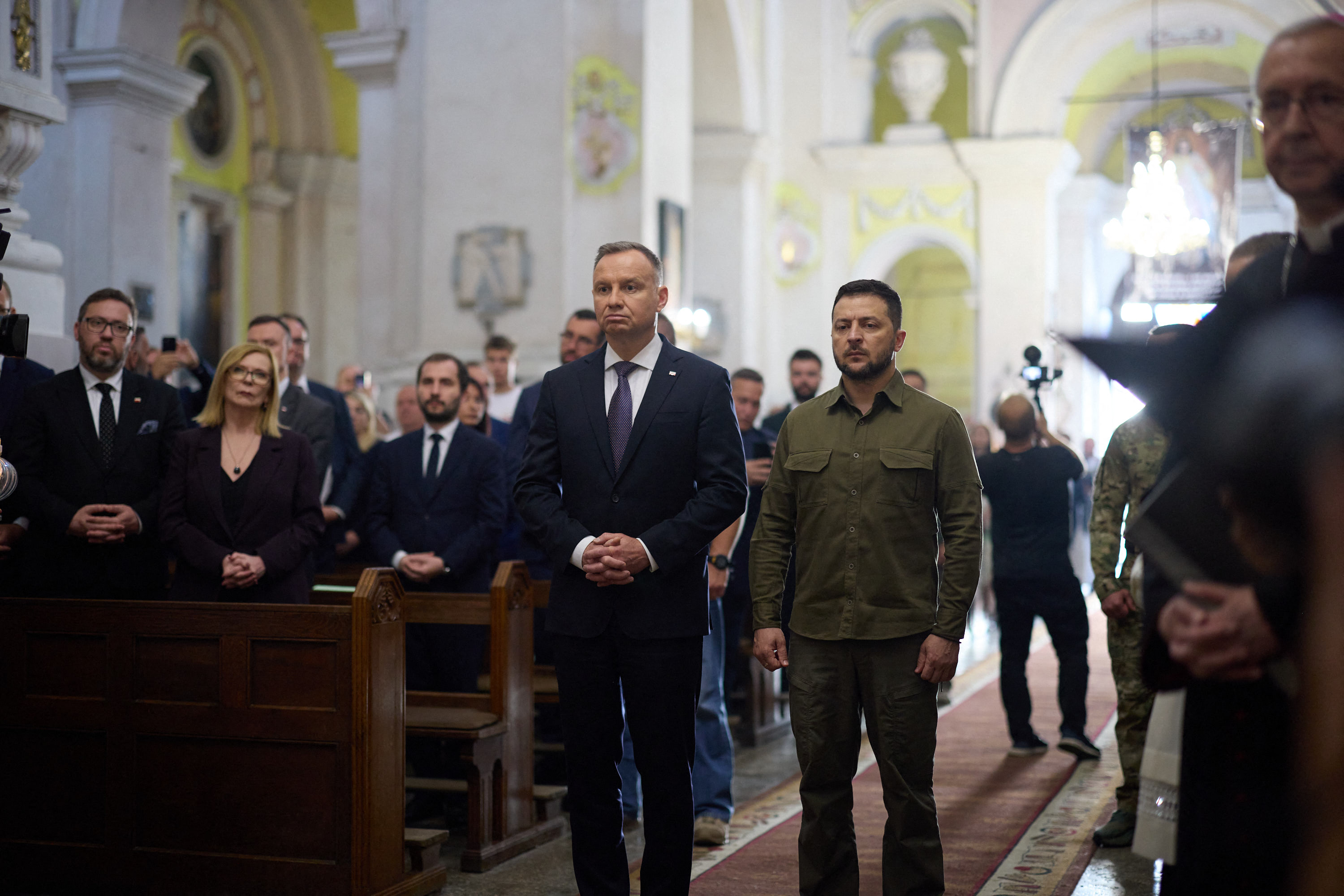 On 9 July 2023, President Volodymyr Zelensky and President Andrzej Duda commemorate the victims of the Volhynia Massacre at the Cathedral of Saints Peter and Paul in Lutsk, Ukraine. © Ukrainian Presidency / Abaca Press via Reuters.