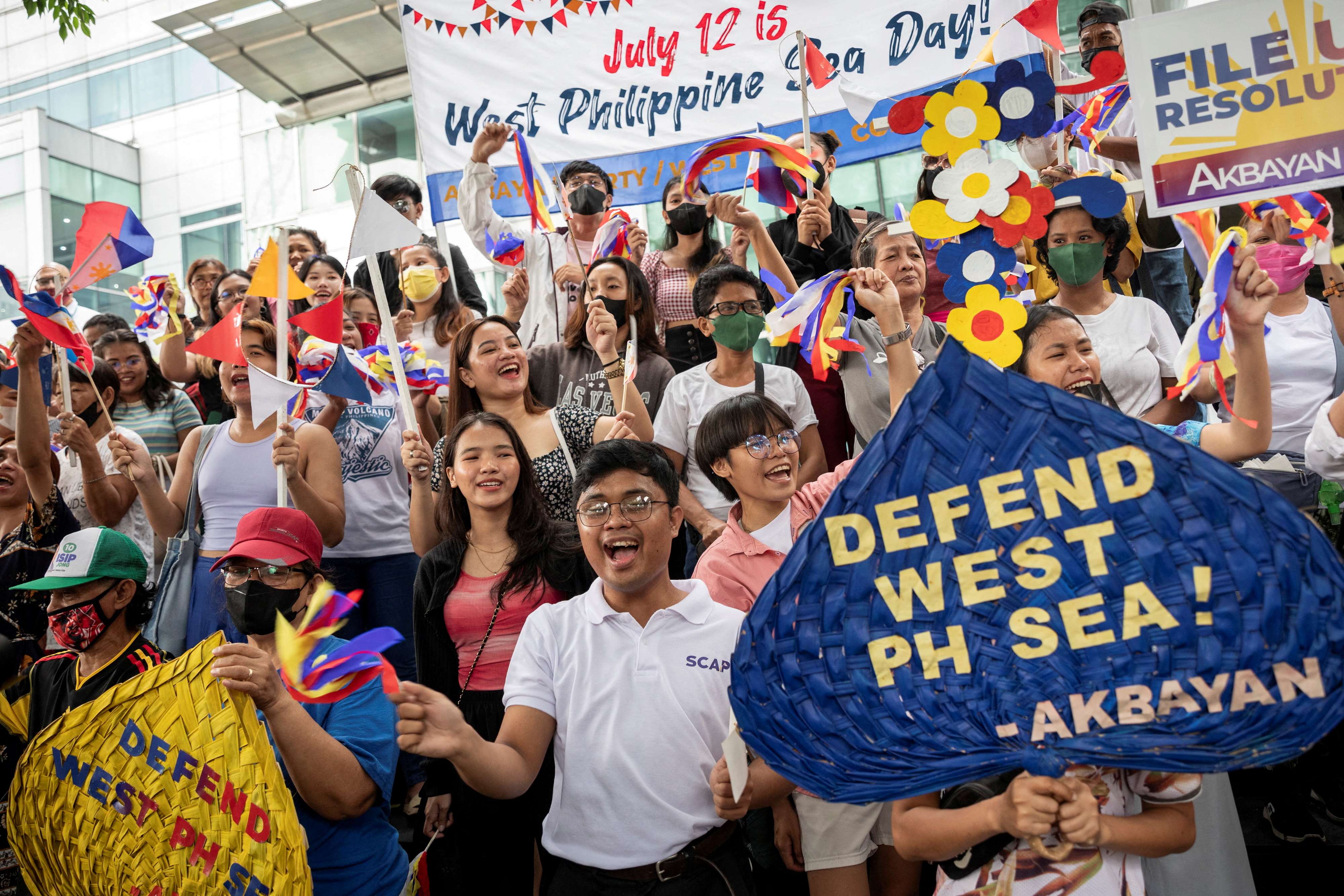 On 12 July 2023, Filipino activists gather outside the Chinese consular office in Makati City, Metro Manila to commemorate the 7th anniversary of the UN’s arbitral ruling on the South China Sea. © Eloisa Lopez via Reuters.