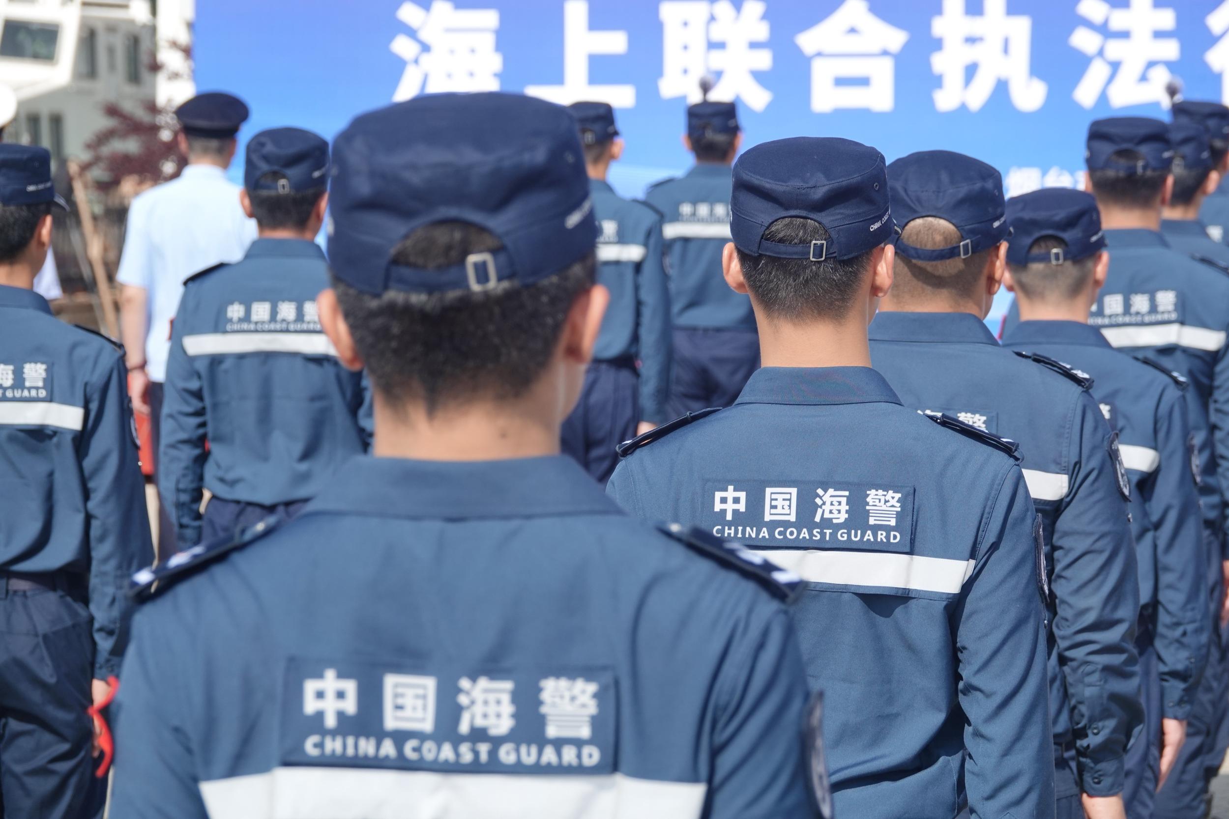 Coast guard officers and soldiers line up to participate in joint maritime law enforcement in Yantai, Shandong province, China, 28 July 2023. © CFOTO/Sipa USA via Reuters