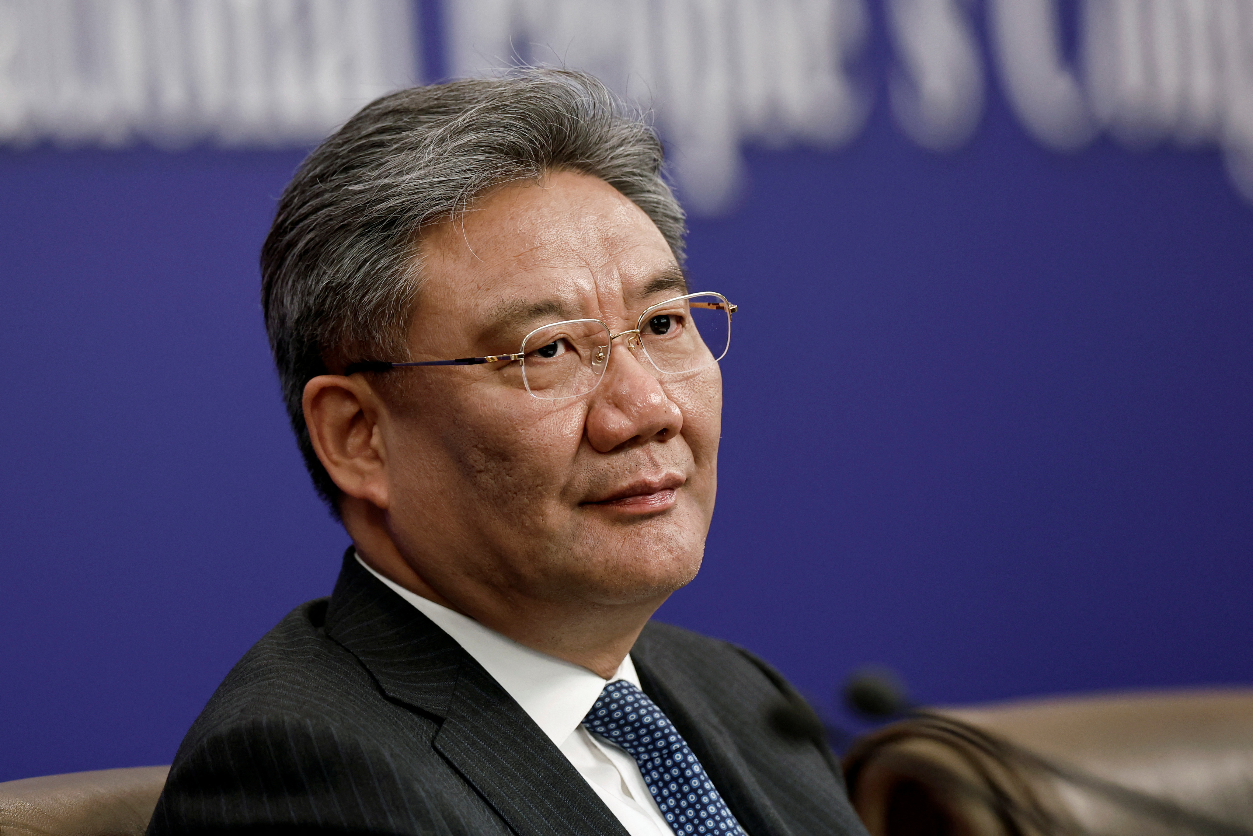 Chinese Commerce Minister Wang Wentao during a press conference on the sidelines of the National People's Congress (NPC), in Beijing, China, 6 March 2024. © Tingshu Wang via Reuters