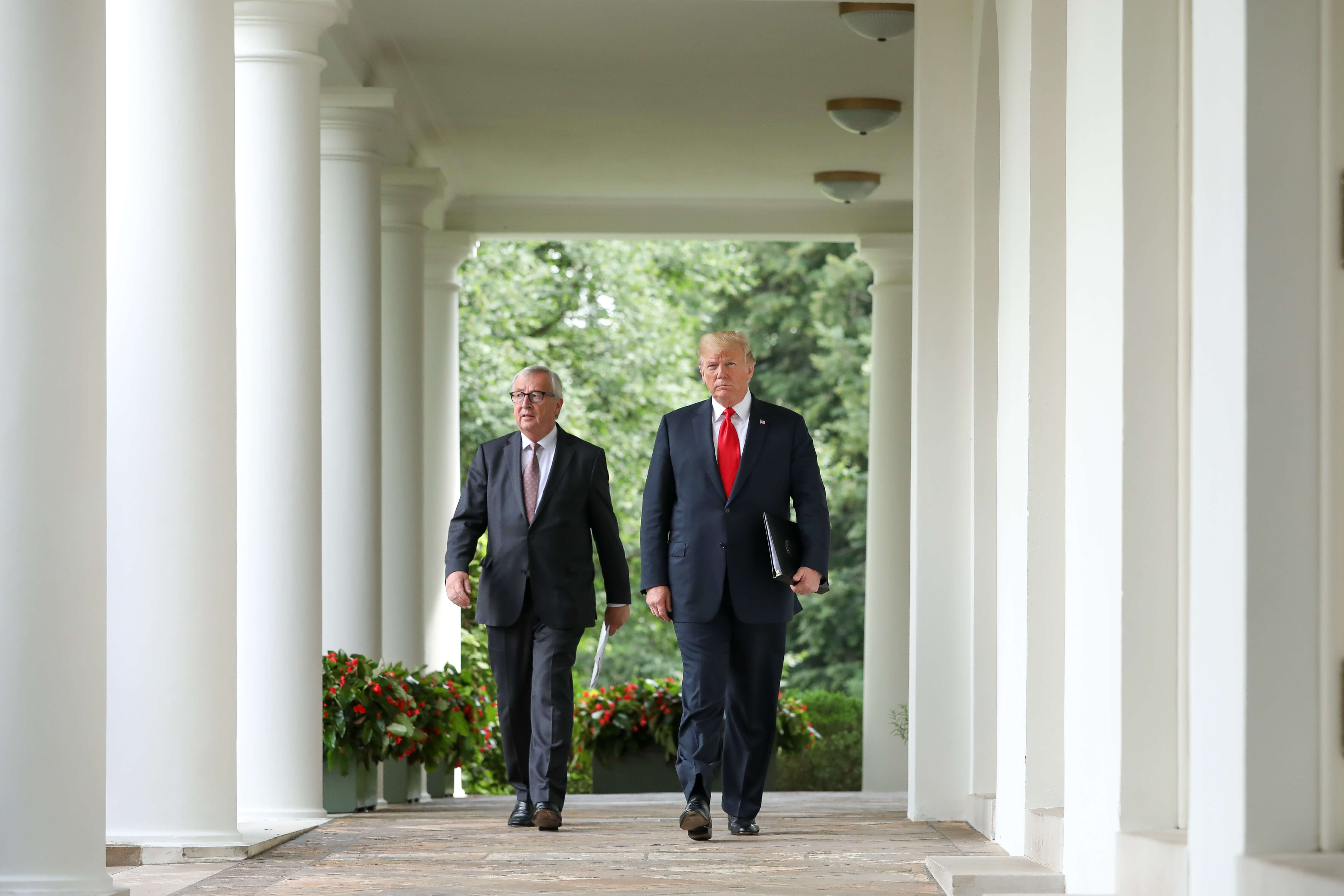 President Trump with then-EU Commission president Jean-Claude Juncker, July 2018. © The Epoch Times/Flickr