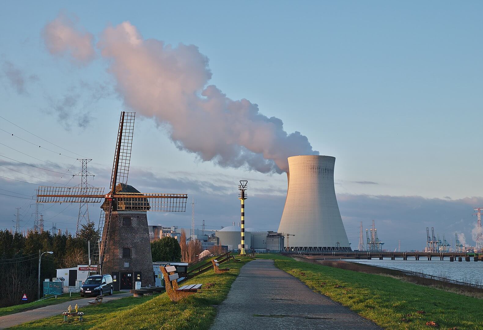 Heffron -Windmill and the nuclear power plant cooling tower in Doel, Belgium. Wikimediacommons