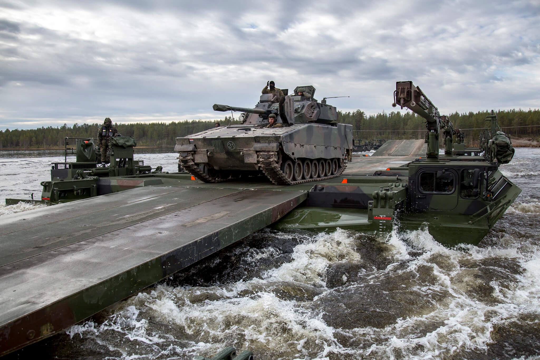 Jurgens - German soldiers cross over Dutch armoured infantry fighting vehicles during NATO's exercise Trident Juncture in 2018. NATO