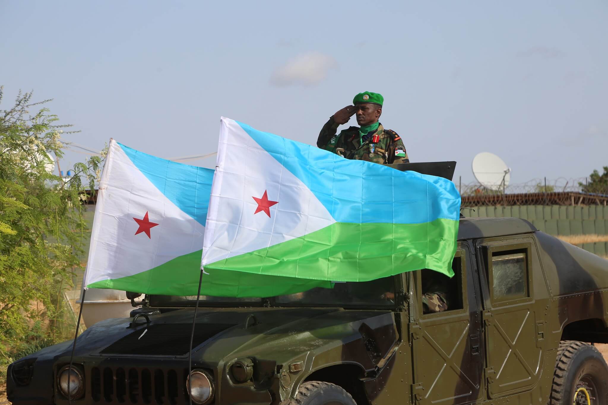 A Djiboutian soldier serving under AMISOM salutes during a parade celebrate Djibouti's 44th Independence Day at AMISOM Sector 4 Headquarters in Beletweyne, Hirshabelle State, on 27 June 2021