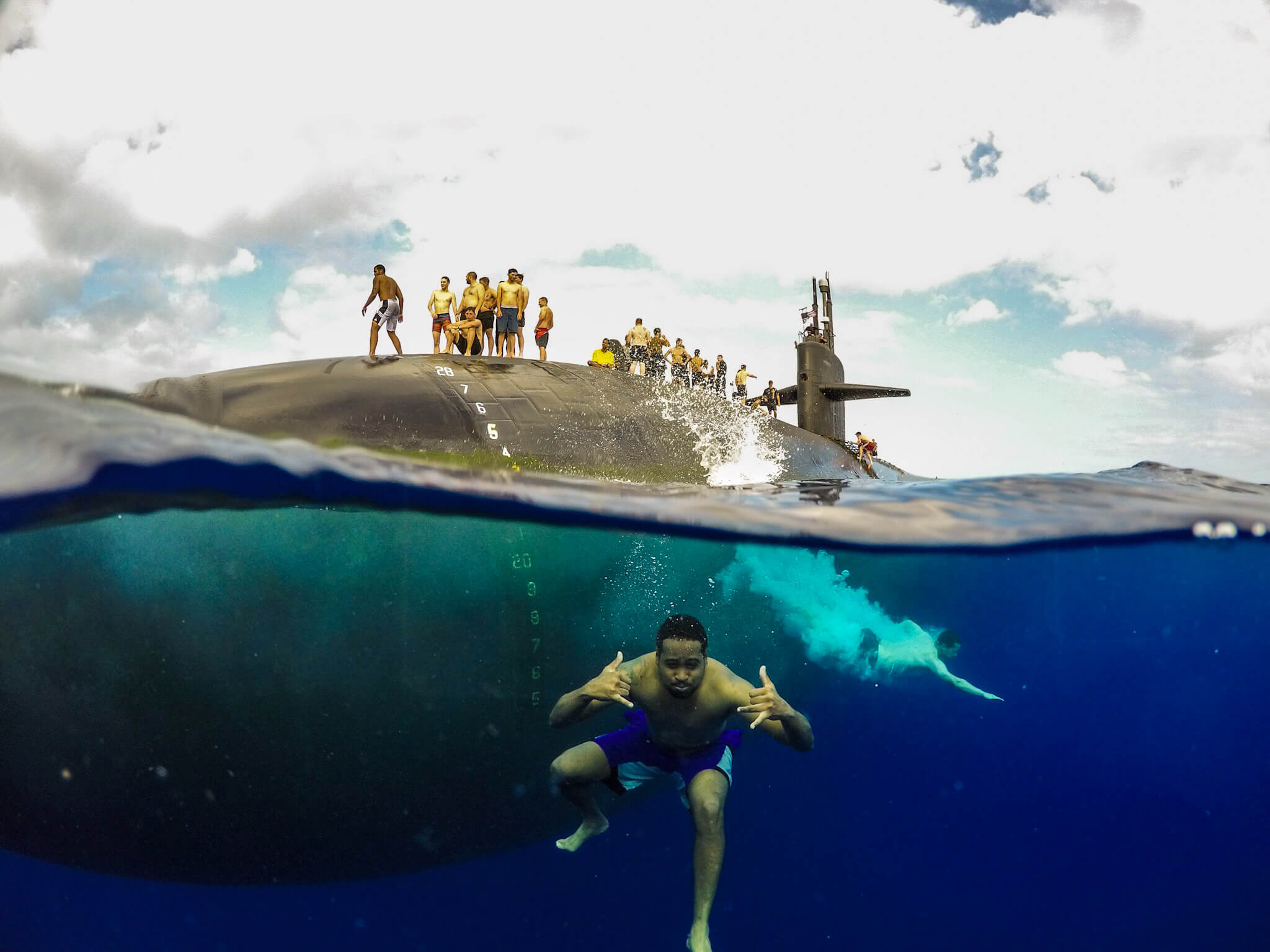Lindley-French-Sailors assigned to Los Angeles-class fast-attack submarine USS Olympia (SSN 717) participate in a swim call in the Pacific Ocean in 2018. U.S. Pacific Fleet 