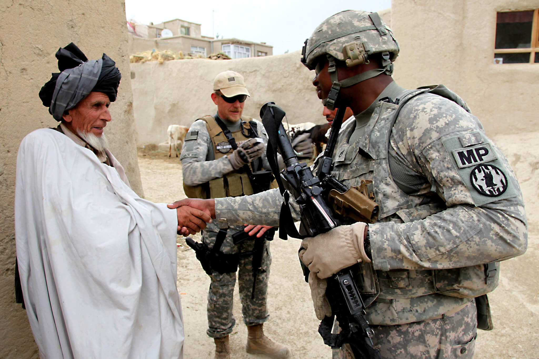 U.S. Army Staff Sgt. Michael Baldwin shakes hands with an elder in the village of Mirsaleh in the Logar province of Afghanistan June 6, 2010.