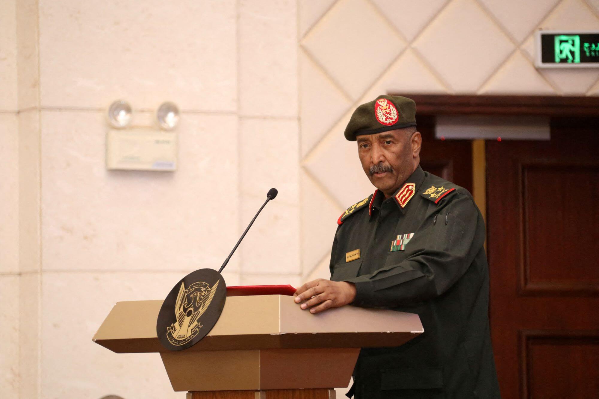 Sudan's military leader General Abdel Fattah al-Burhan stands at the podium during a ceremony to sign the framework agreement between military rulers and civilian powers in Khartoum, Sudan in December 2022. © Reuters