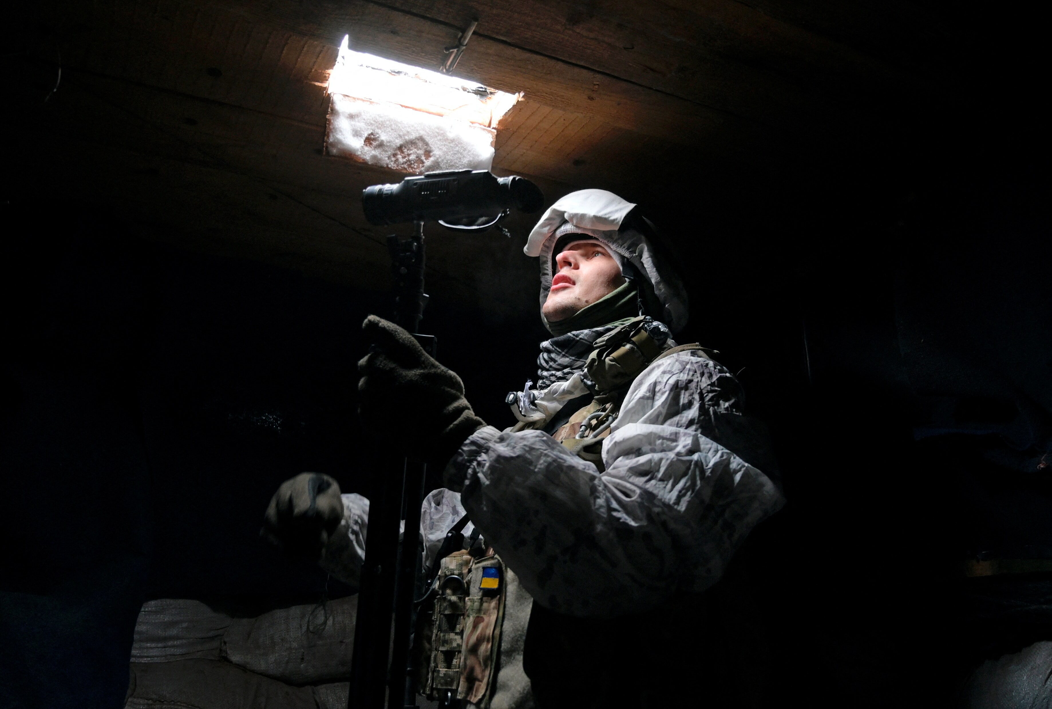 Tack - A service member of the Ukrainian armed forces is seen at combat positions in Donetsk Region in  Ukraine on January 25, 2022. Reuters