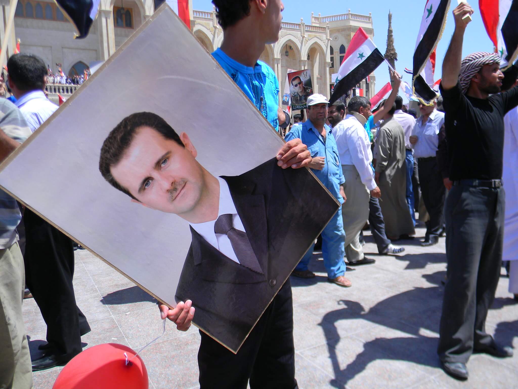 Pro-Assad protest in 2010, vlak voor het uitbreken van de burgeroorlog. © Flickr - Beshr Abdulhadi 